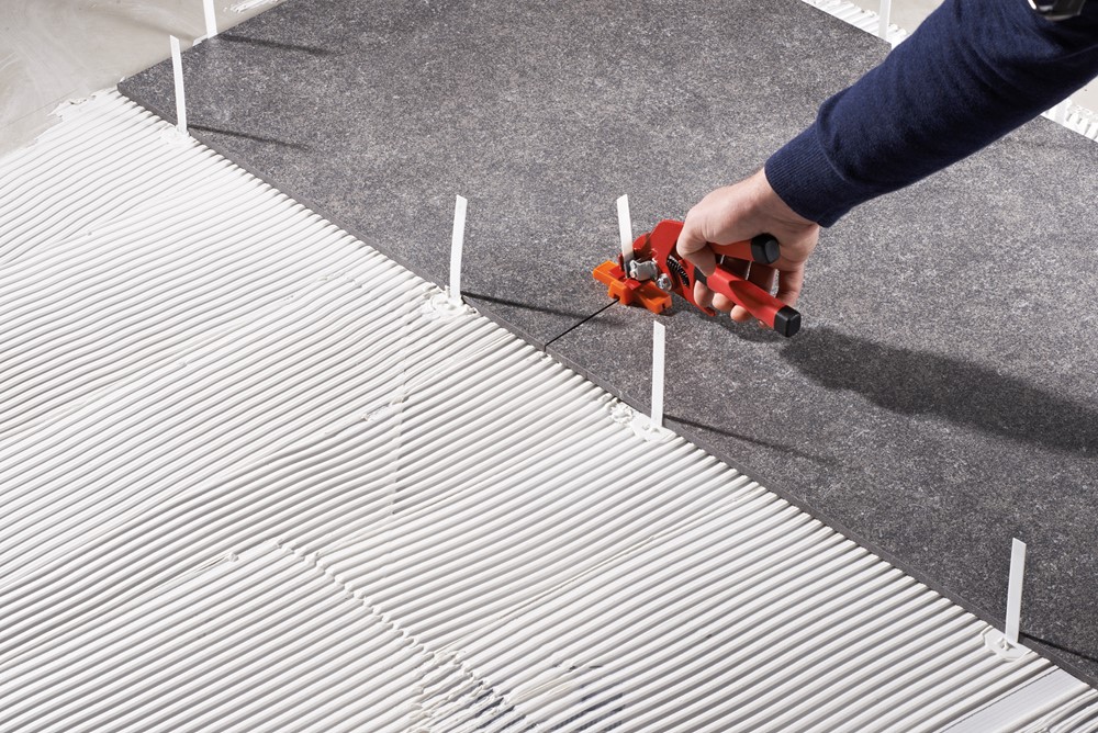 Tegelkruisjes, spies en niveleersystemen